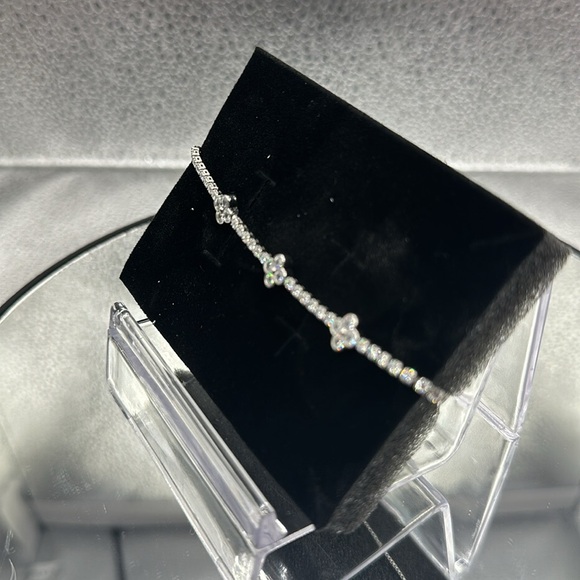 This bracelet is silver over brass with beautiful CZs and is adjustable. - Picture 4 of 8